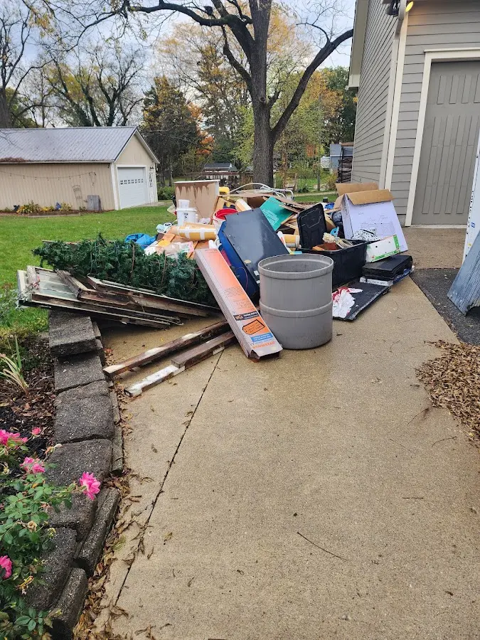 Dumpster being loaded with debris for 30 Yard Dumpster Rental in Westminster